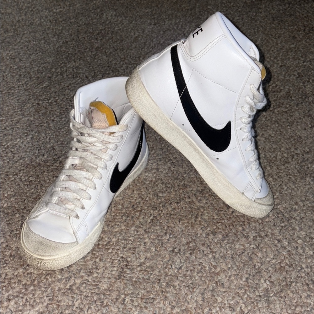Nike White High-Top Sneakers with Black Swoosh